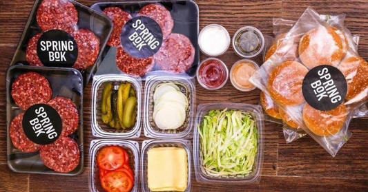 Springbok Burger Box - 12 SOFT BUNS, 12 BEEF PATTIES, 1 KG POTATO WEDGES & Lettuce, Tomatoes, Onions, Cheddar Cheese Slices, Pickles, Springbok's Famous Sauce, Tomato Relish Dressing.